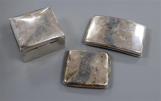 A square silver cigarette box and two George V silver cigarette cases